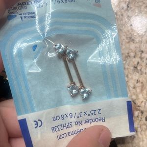 Diamond heart nipple piercing